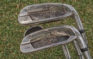 Restored golf irons after professional cleaning and refinishing
